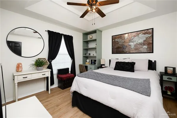 a bed room with a bed and a television