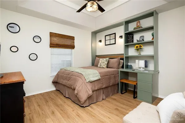 a bedroom with a bed and a bookshelf