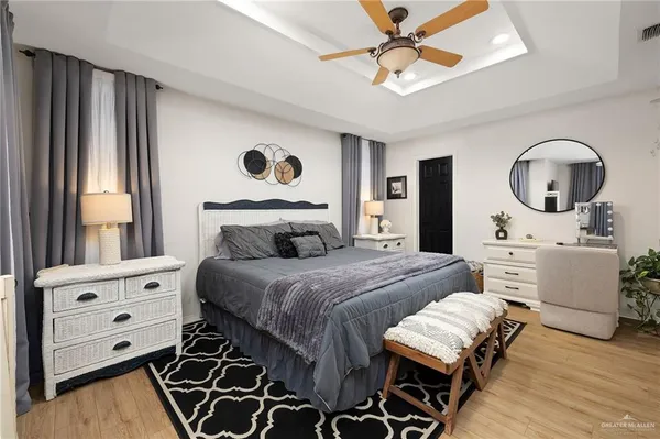 a bedroom with a bed and a dresser