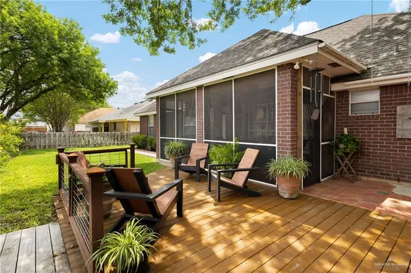 a backyard of a house with table and chairs