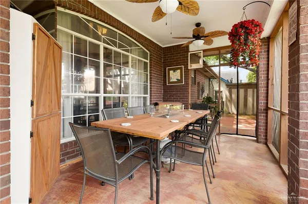 a view of a patio with a table and chairs