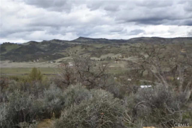 a view of beach and mountains