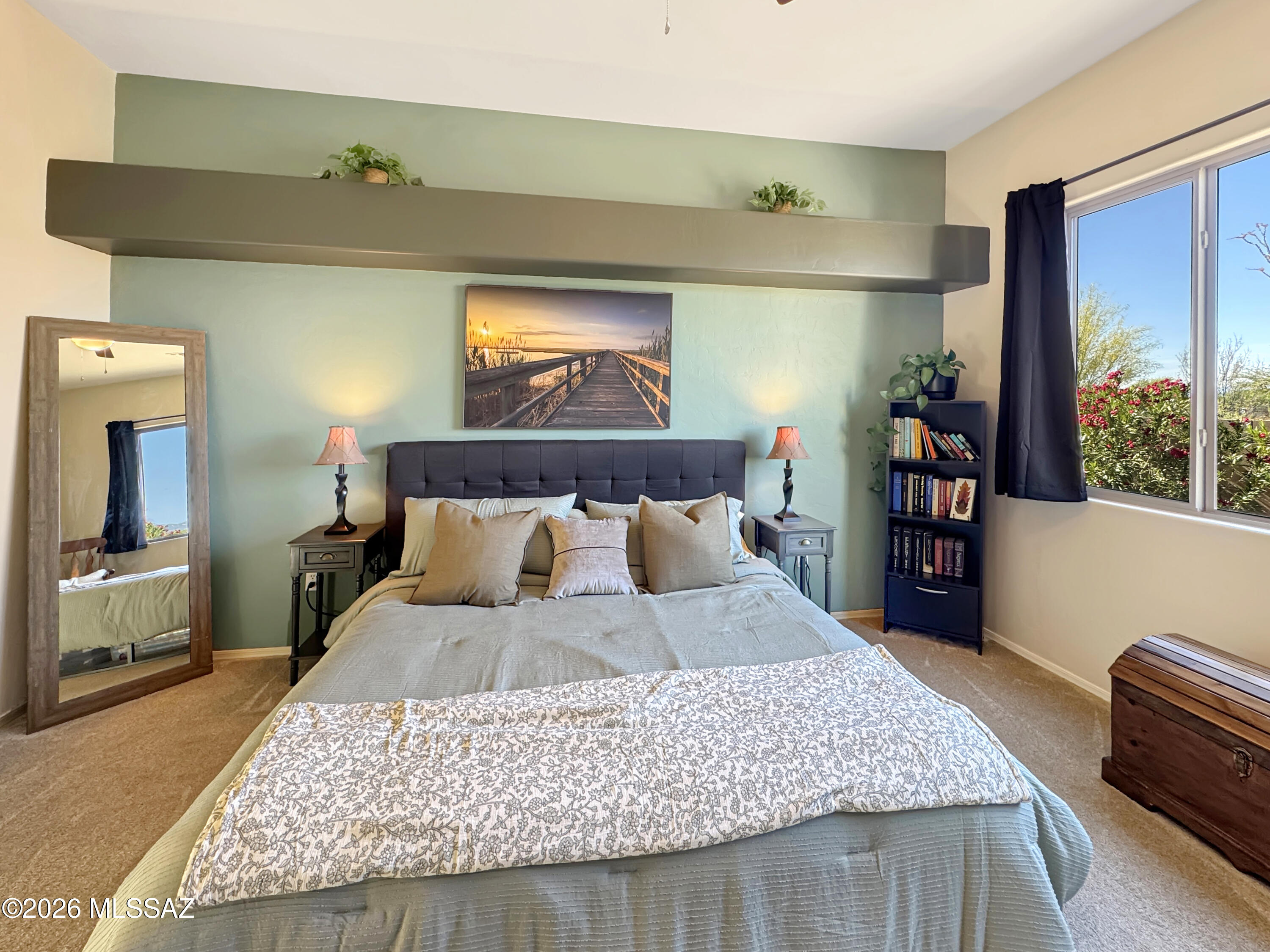 10835 South Heart Break Ridge Place Vail, AZ 85641 - Photo 21 of 49 a bed sitting in a bedroom next to a window