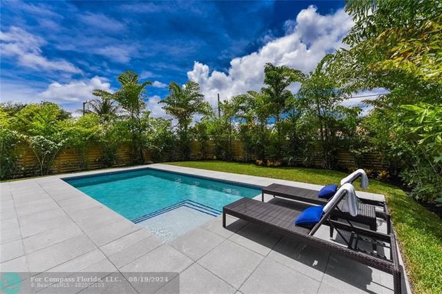 a view of a yard with chairs