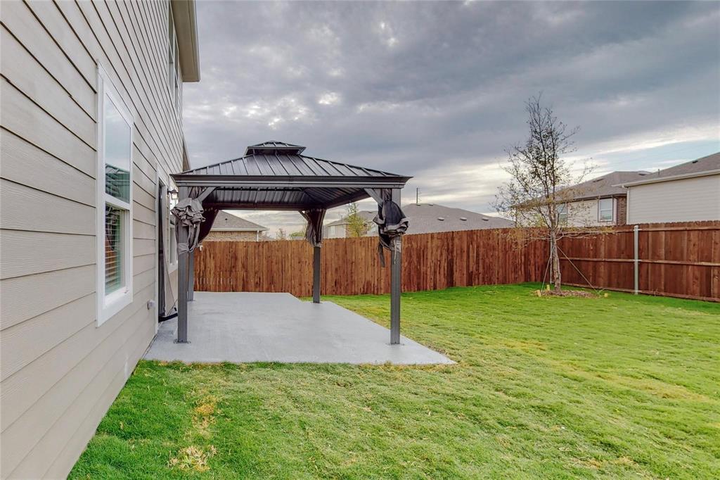 407 Madison Way Princeton, TX 75407 - Photo 19 of 40 Fenced backyard featuring a patio and a gazebo