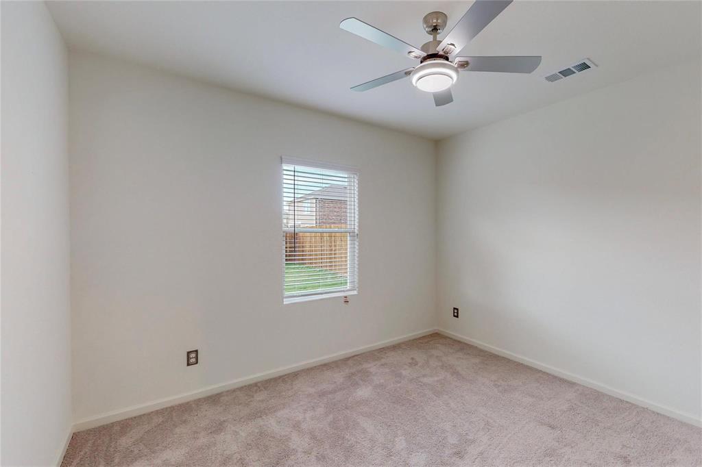 407 Madison Way Princeton, TX 75407 - Photo 21 of 40 Empty room featuring light colored carpet and ceiling fan