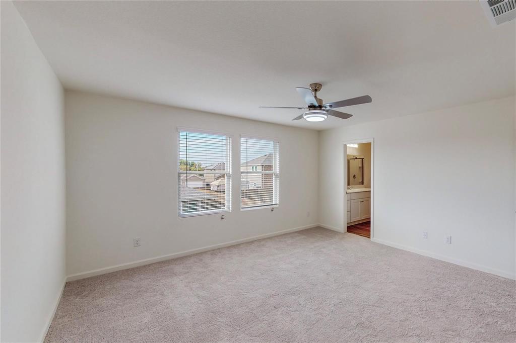407 Madison Way Princeton, TX 75407 - Photo 25 of 40 Empty room with light carpet and a ceiling fan