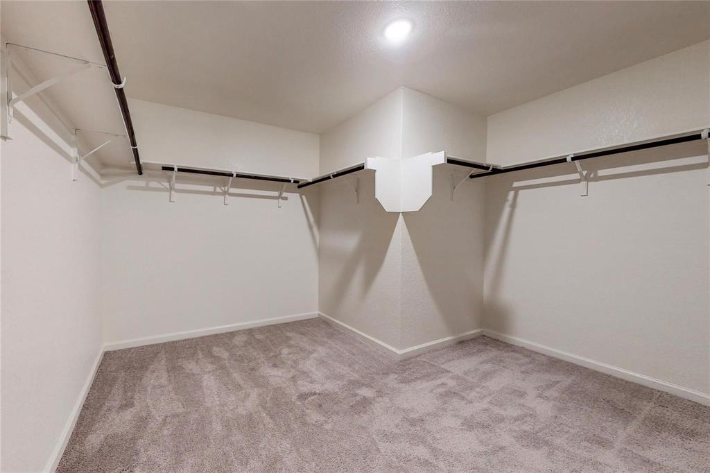 407 Madison Way Princeton, TX 75407 - Photo 28 of 40 Walk in closet with carpet floors
