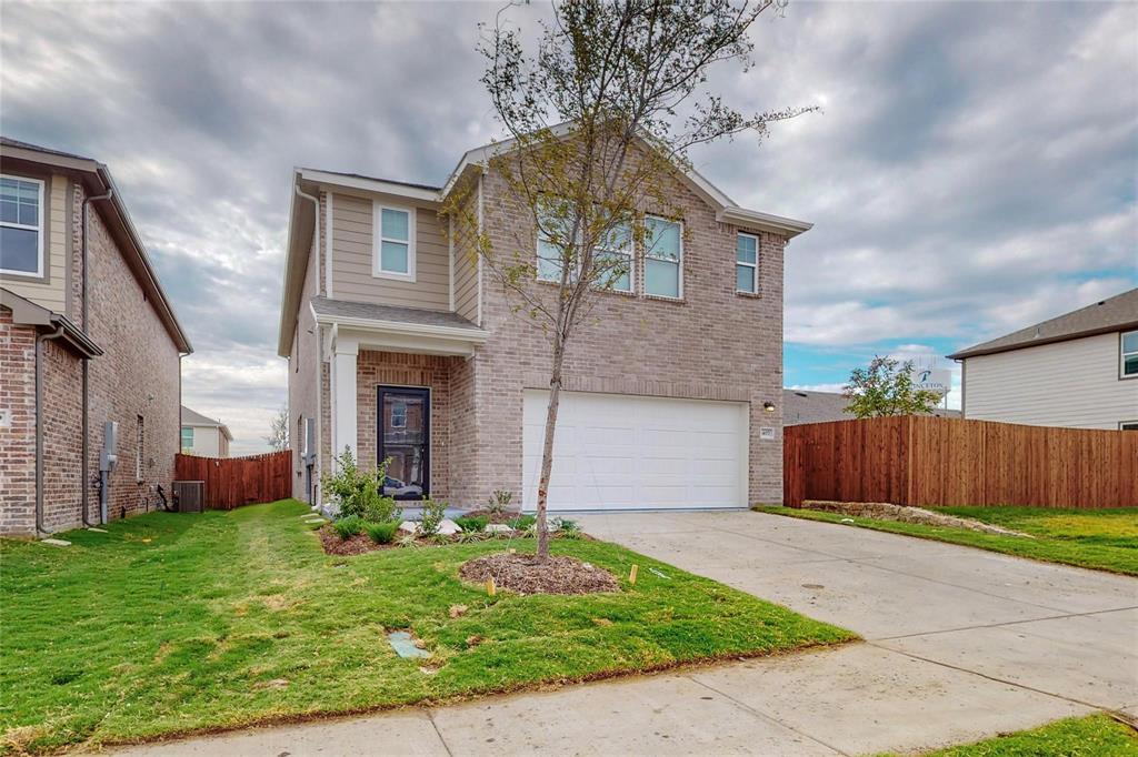 407 Madison Way Princeton, TX 75407 - Photo 3 of 40 Traditional-style house with an attached garage, concrete driveway, and brick siding