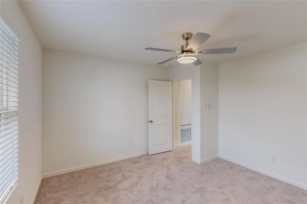 407 Madison Way Princeton, TX 75407 - Photo 31 of 40 Unfurnished room featuring ceiling fan and light carpet