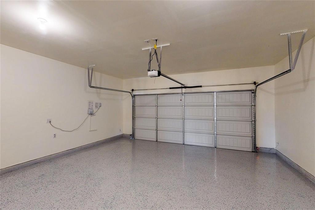 407 Madison Way Princeton, TX 75407 - Photo 37 of 40 Garage featuring baseboards