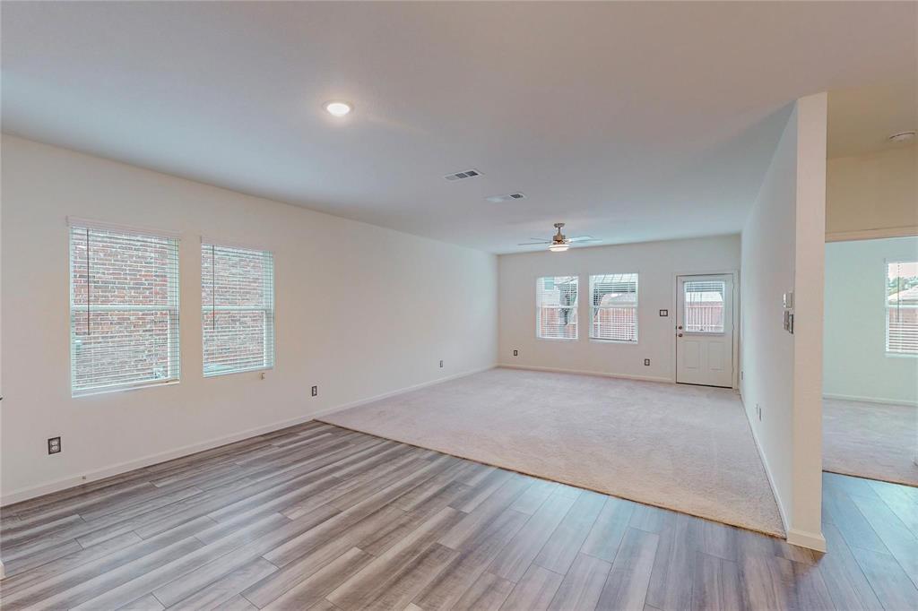 407 Madison Way Princeton, TX 75407 - Photo 6 of 40 Unfurnished room featuring light wood-style flooring and a ceiling fan
