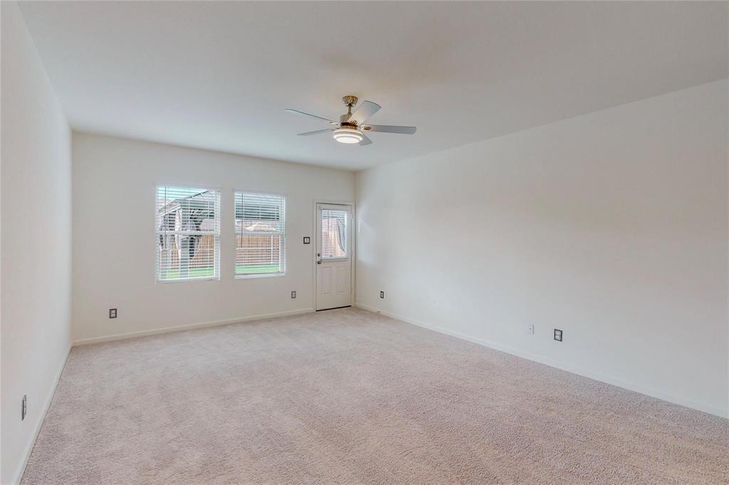 407 Madison Way Princeton, TX 75407 - Photo 9 of 40 Unfurnished room with ceiling fan and light carpet