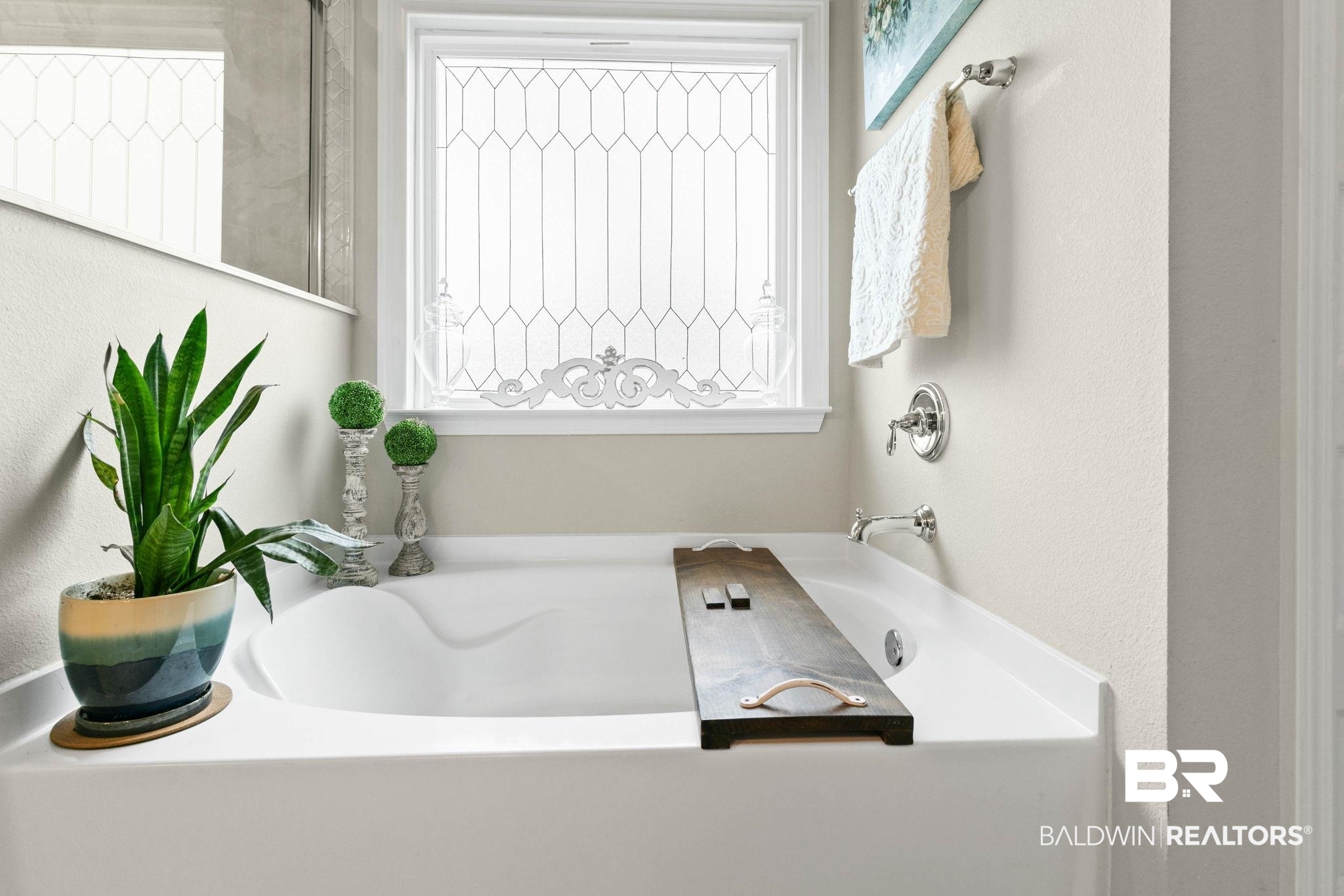 31187 Spoonbill Road Daphne, AL 36527 - Photo 29 of 85 Built-in soaking tub with chrome fixtures and an obscured-glass window featuring decorative mullions