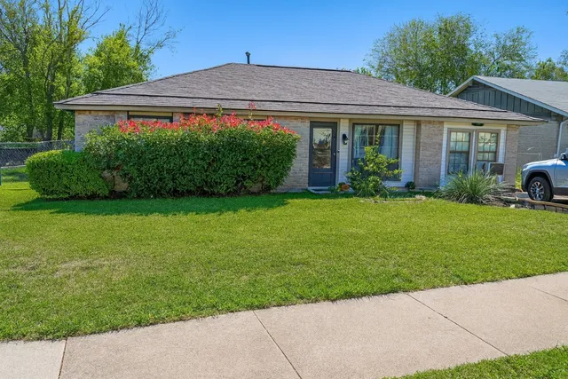 a view of a house with a garden