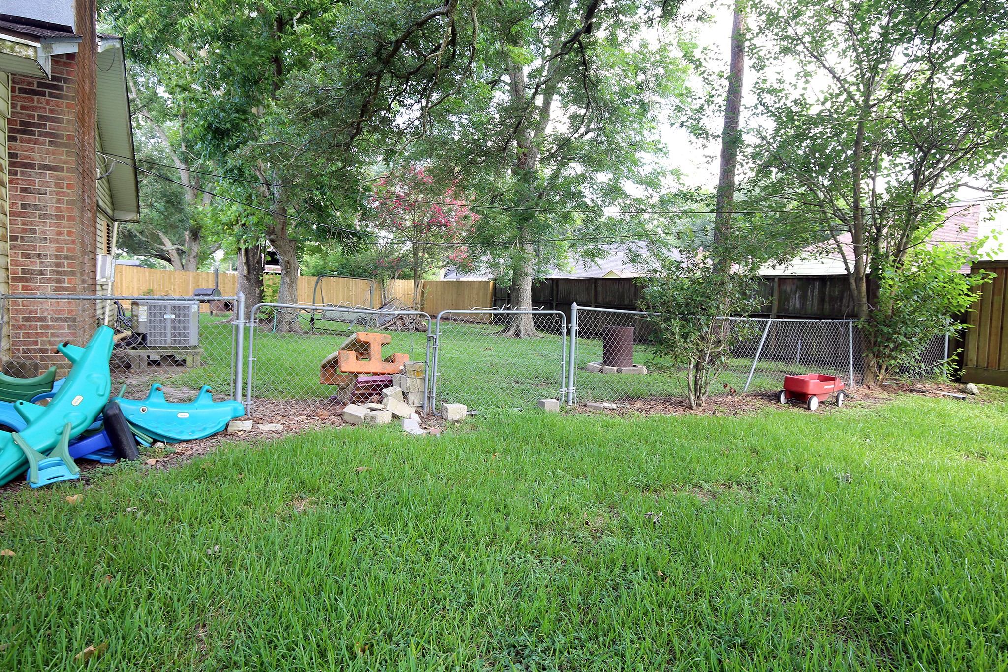 4406 FM 646 Road Santa Fe, TX 77510 - Photo 3 of 26 The side yard is fenced for your kids or your animals to be in a safe spot!
