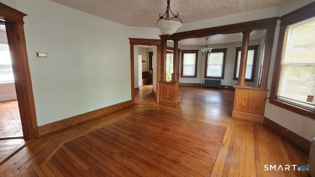 64-66 Ridge Street Manchester, CT 06040 - Photo 17 of 21 a view of empty room with wooden floor and fan