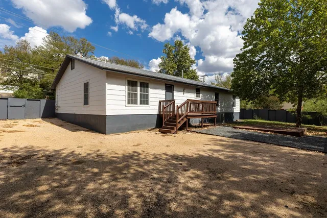 a house with trees in the background