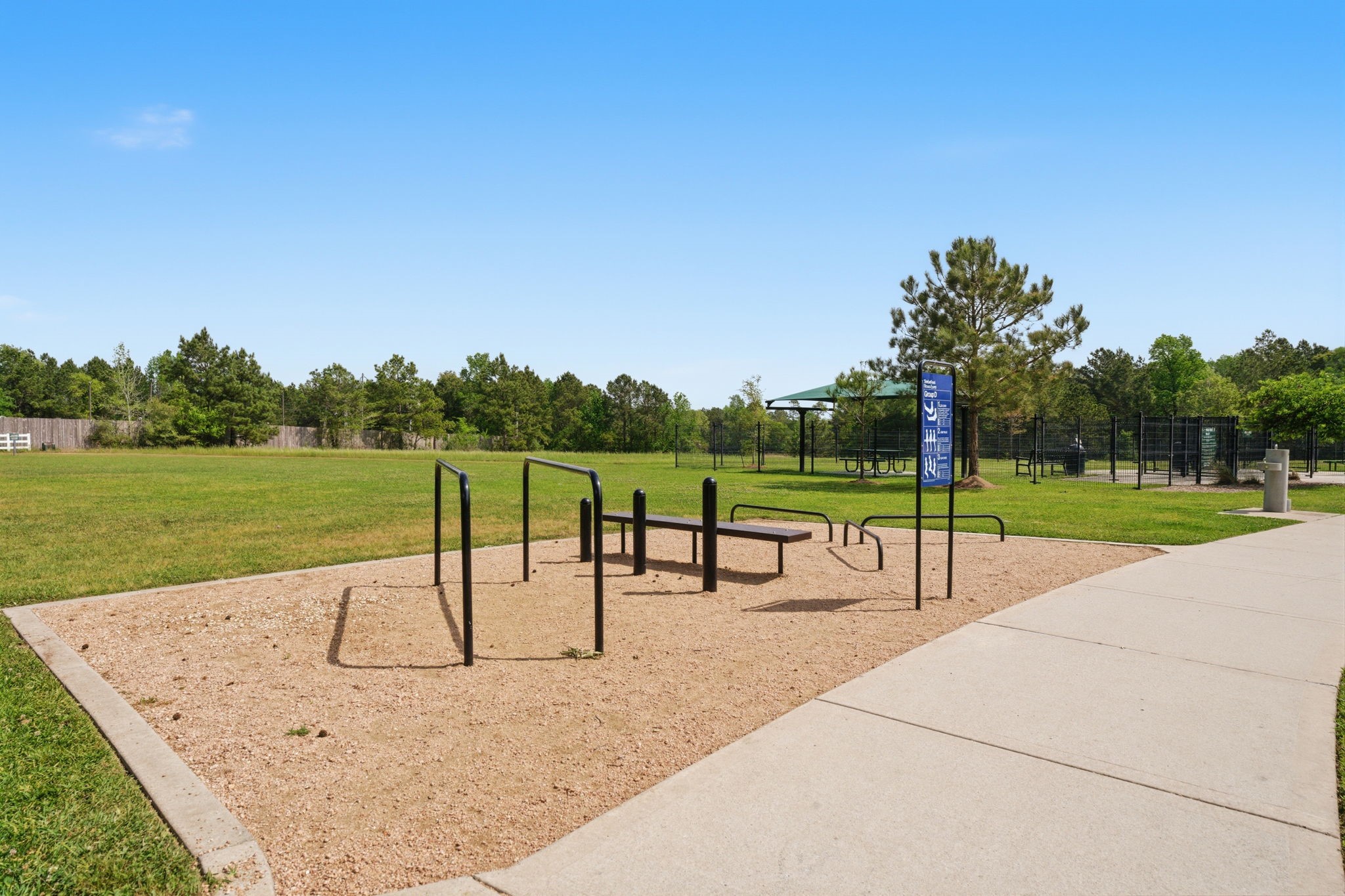 315 Arbor Ridge Lane Conroe, TX 77384 - Photo 44 of 48 a park view with a bench