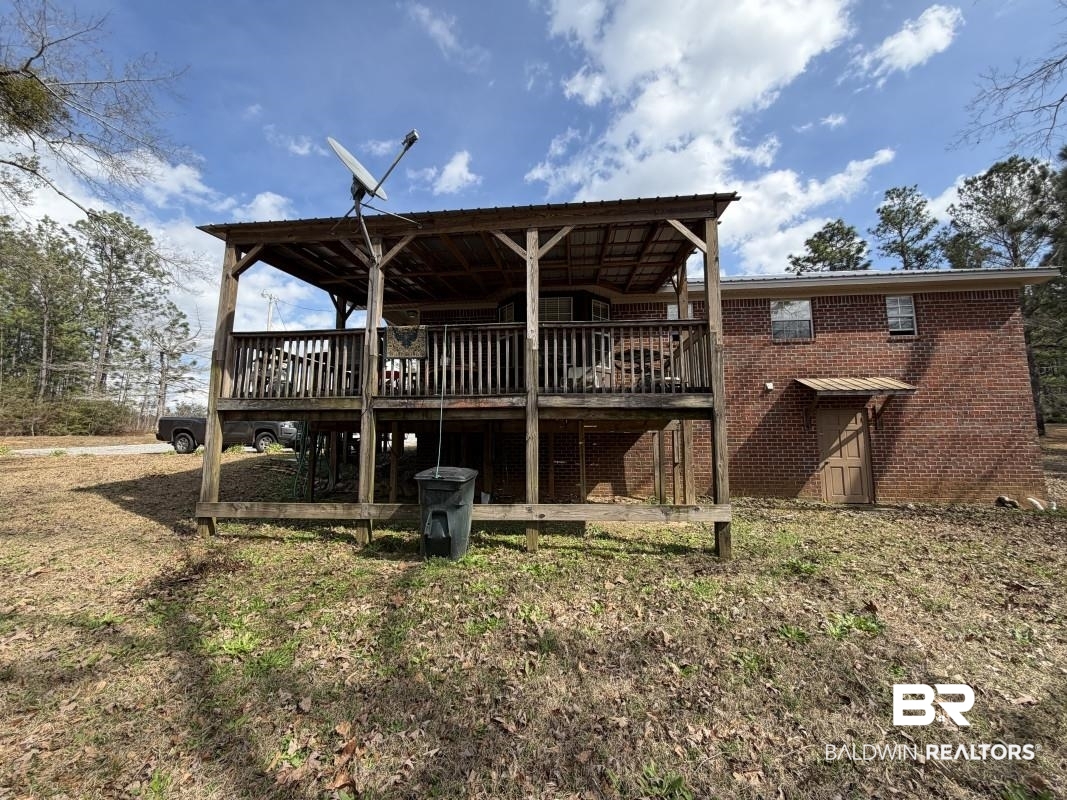 19225 Joan Harris Road Mount Vernon, AL 36560 - Photo 2 of 7 Back of property with a deck and brick siding