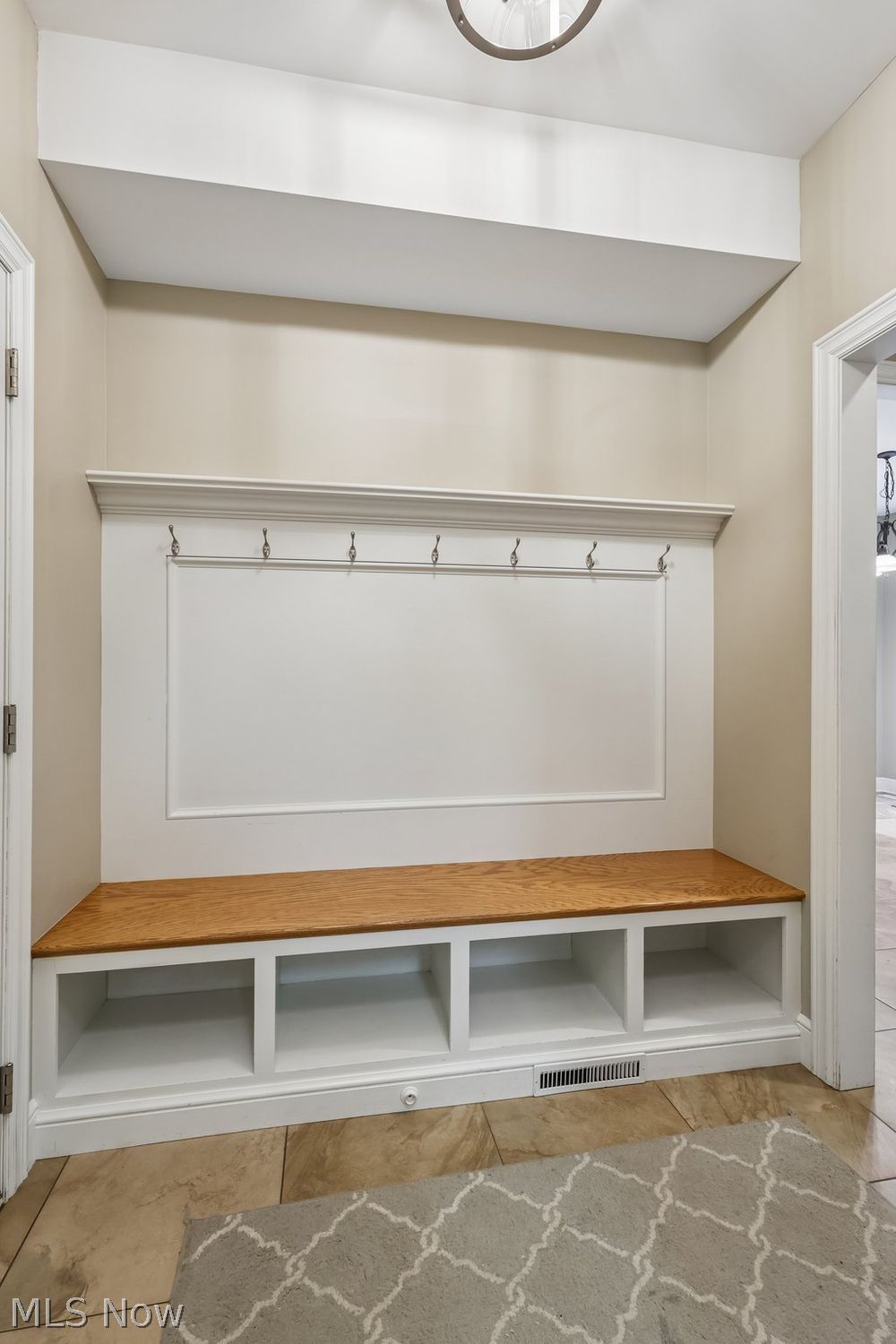 6836 Kyle Ridge Pointe Canfield, OH 44406 - Photo 21 of 45 enter to mudroom from garage, built in bench with space for shoes and hooks to hang up coats and bags