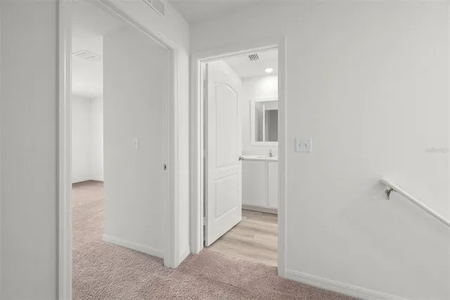 a view of a bathroom from the hallway