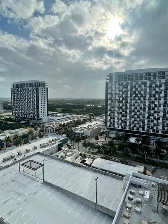 a front view of a building with lake view and a yard