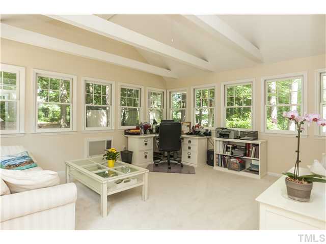 5609 Knollwood Road Raleigh, NC 27609 - Photo 12 of 25 a living room with furniture and large windows