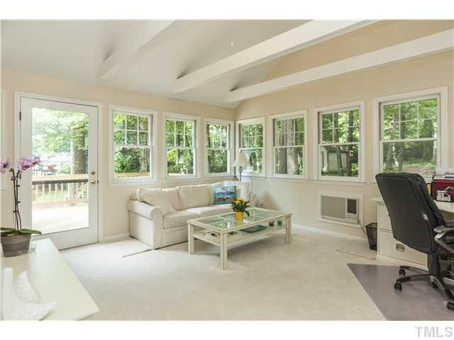 5609 Knollwood Road Raleigh, NC 27609 - Photo 13 of 25 a living room with furniture and a large window