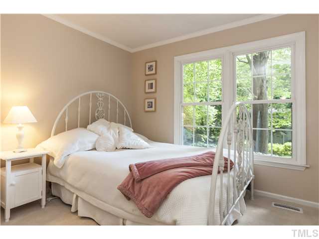 5609 Knollwood Road Raleigh, NC 27609 - Photo 16 of 25 a bedroom with a bed and a window