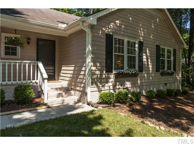 5609 Knollwood Road Raleigh, NC 27609 - Photo 2 of 25 a front view of a house with a porch