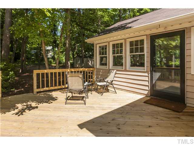 5609 Knollwood Road Raleigh, NC 27609 - Photo 21 of 25 a view of a patio with table and chairs with wooden floor and fence