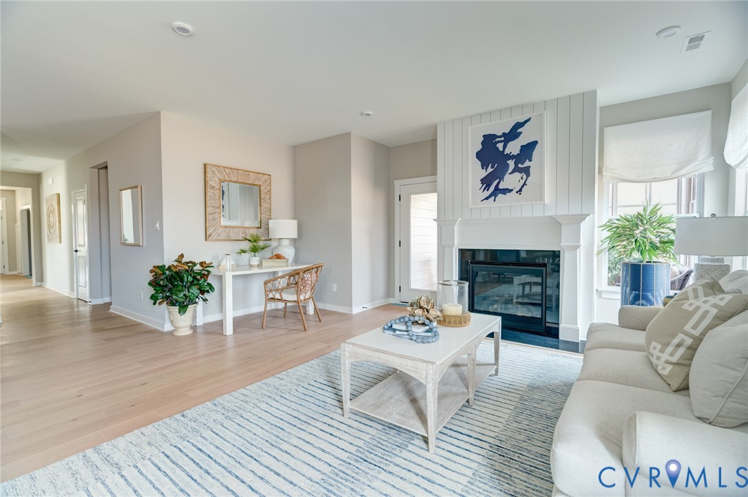 16000 Canoe Pointe Loop, Unit 164 Moseley, VA 23120 - Photo 11 of 29 a living room with furniture and a fireplace