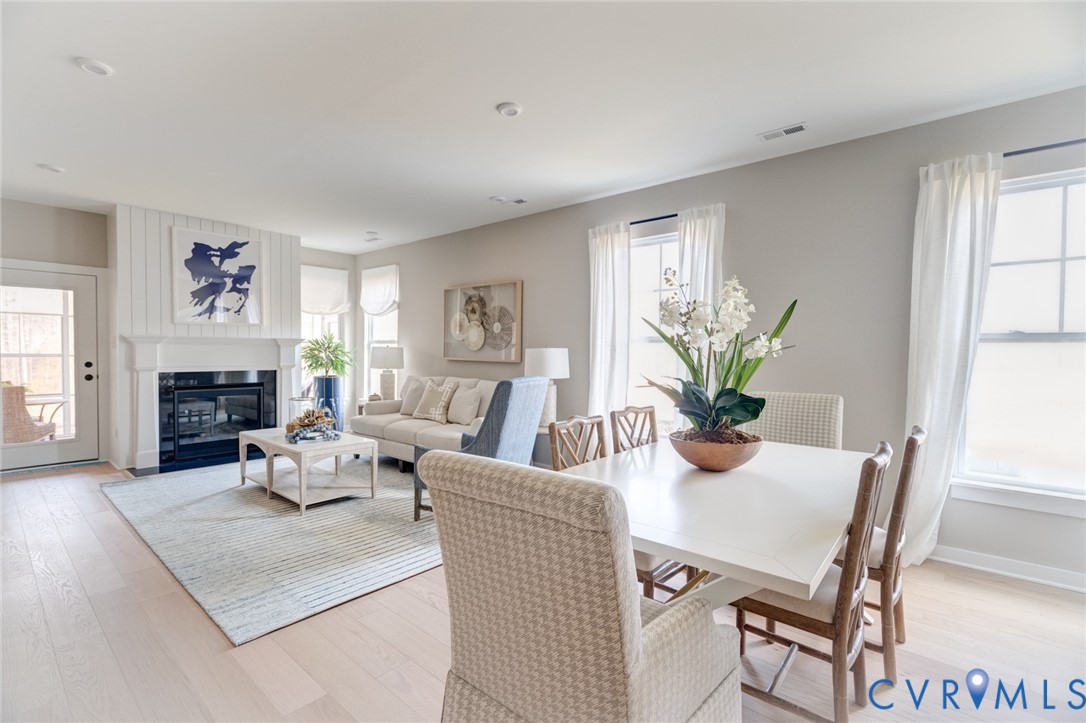 16000 Canoe Pointe Loop, Unit 164 Moseley, VA 23120 - Photo 17 of 29 a living room with fireplace furniture and a wooden floor
