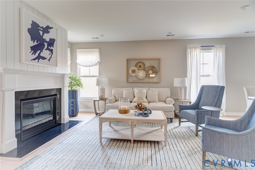 16000 Canoe Pointe Loop, Unit 164 Moseley, VA 23120 - Photo 20 of 29 a living room with furniture and a fireplace