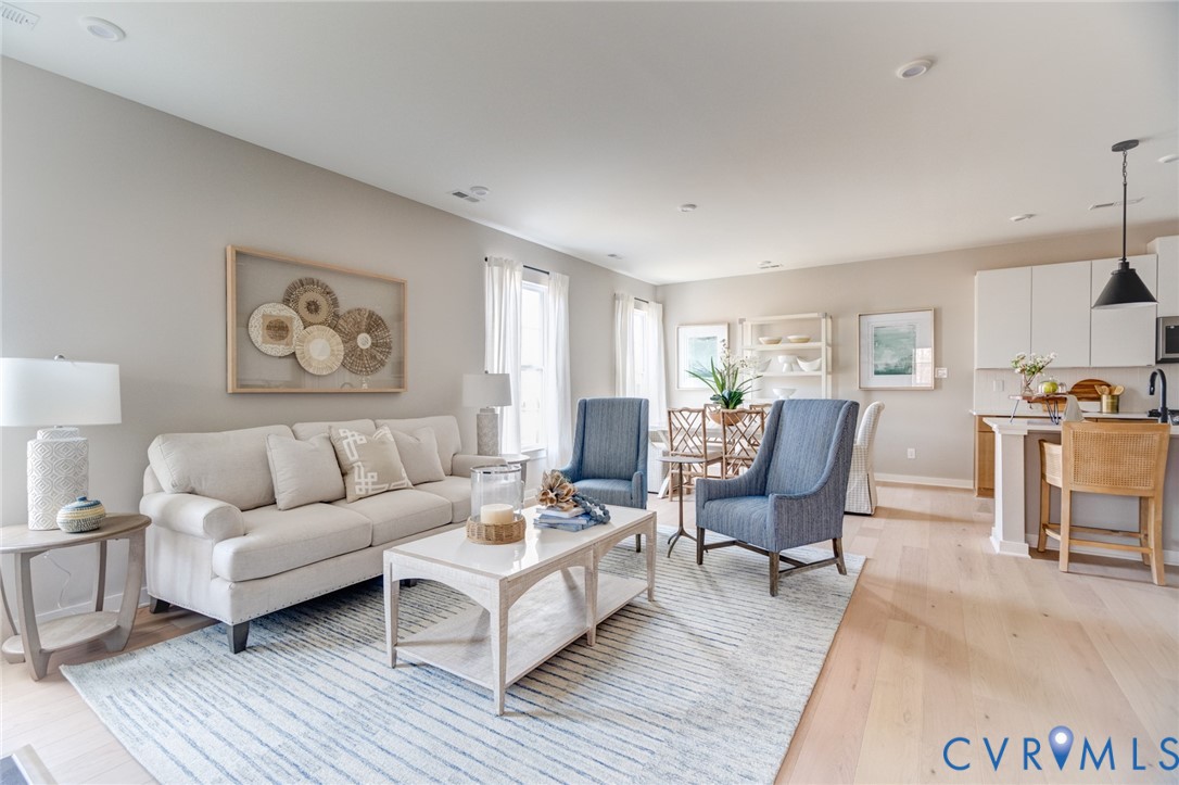 16000 Canoe Pointe Loop, Unit 164 Moseley, VA 23120 - Photo 21 of 29 a living room with furniture and wooden floor