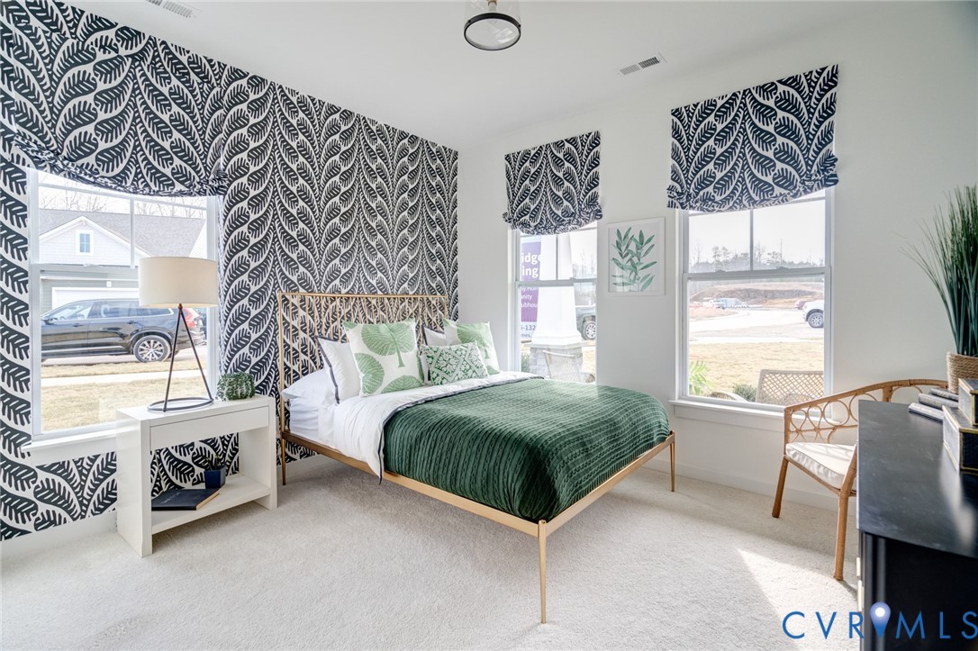 16000 Canoe Pointe Loop, Unit 164 Moseley, VA 23120 - Photo 23 of 29 a bedroom with a bed and a window