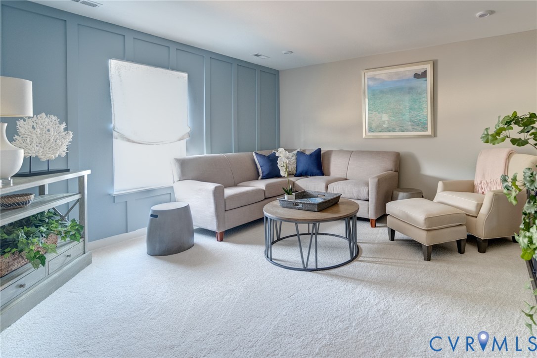 16000 Canoe Pointe Loop, Unit 164 Moseley, VA 23120 - Photo 26 of 29 a living room with furniture a rug and a window