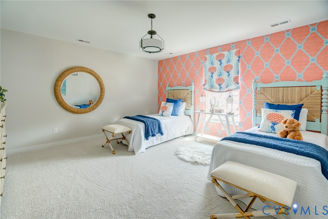 16000 Canoe Pointe Loop, Unit 164 Moseley, VA 23120 - Photo 27 of 29 a bedroom with a bed and a chair