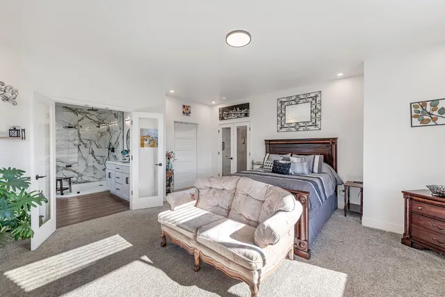 a bedroom with a bed and a couch