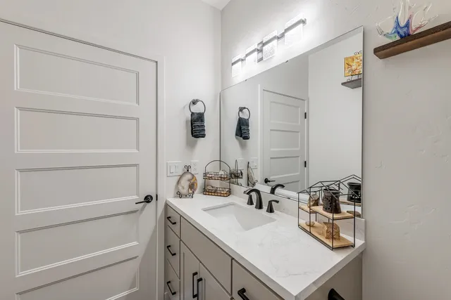 a bathroom with a sink and a mirror