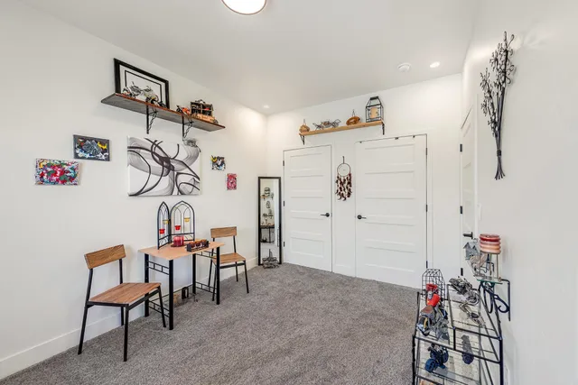 an aerial view of residential houses with outdoor space and parking