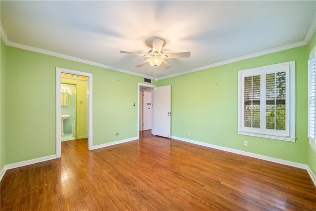 a bathroom with a sink mirror and toilet