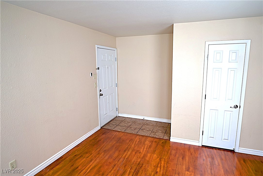 2451 North Rainbow Boulevard, Unit 1020 Las Vegas, NV 89108 - Photo 7 of 14 Foyer featuring wood finished floors and baseboards