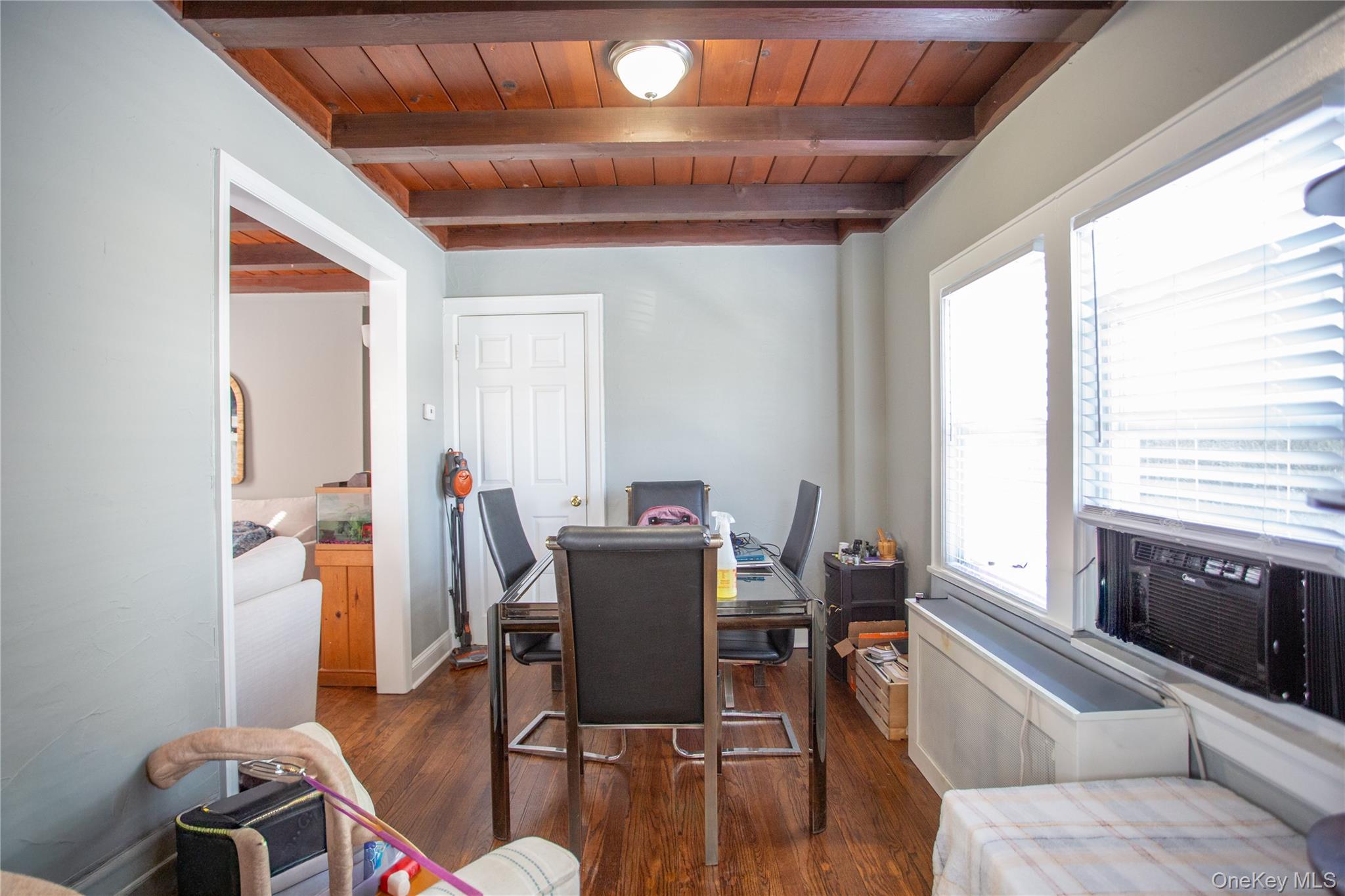261 Rutland Road Freeport, NY 11520 - Photo 14 of 15 a view of a dining room with furniture window and wooden floor