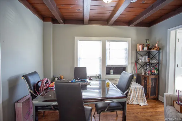 a view of a dining room with furniture window and outside view