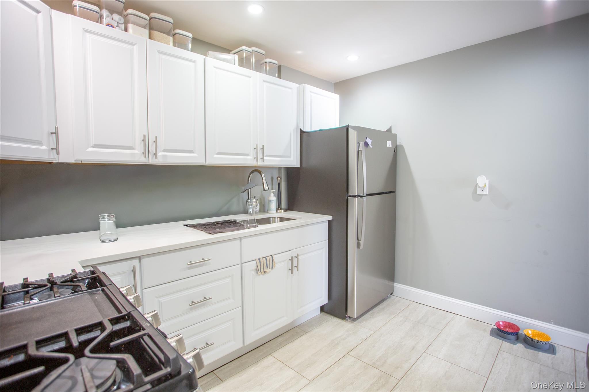 261 Rutland Road Freeport, NY 11520 - Photo 4 of 15 a kitchen with appliances and cabinets