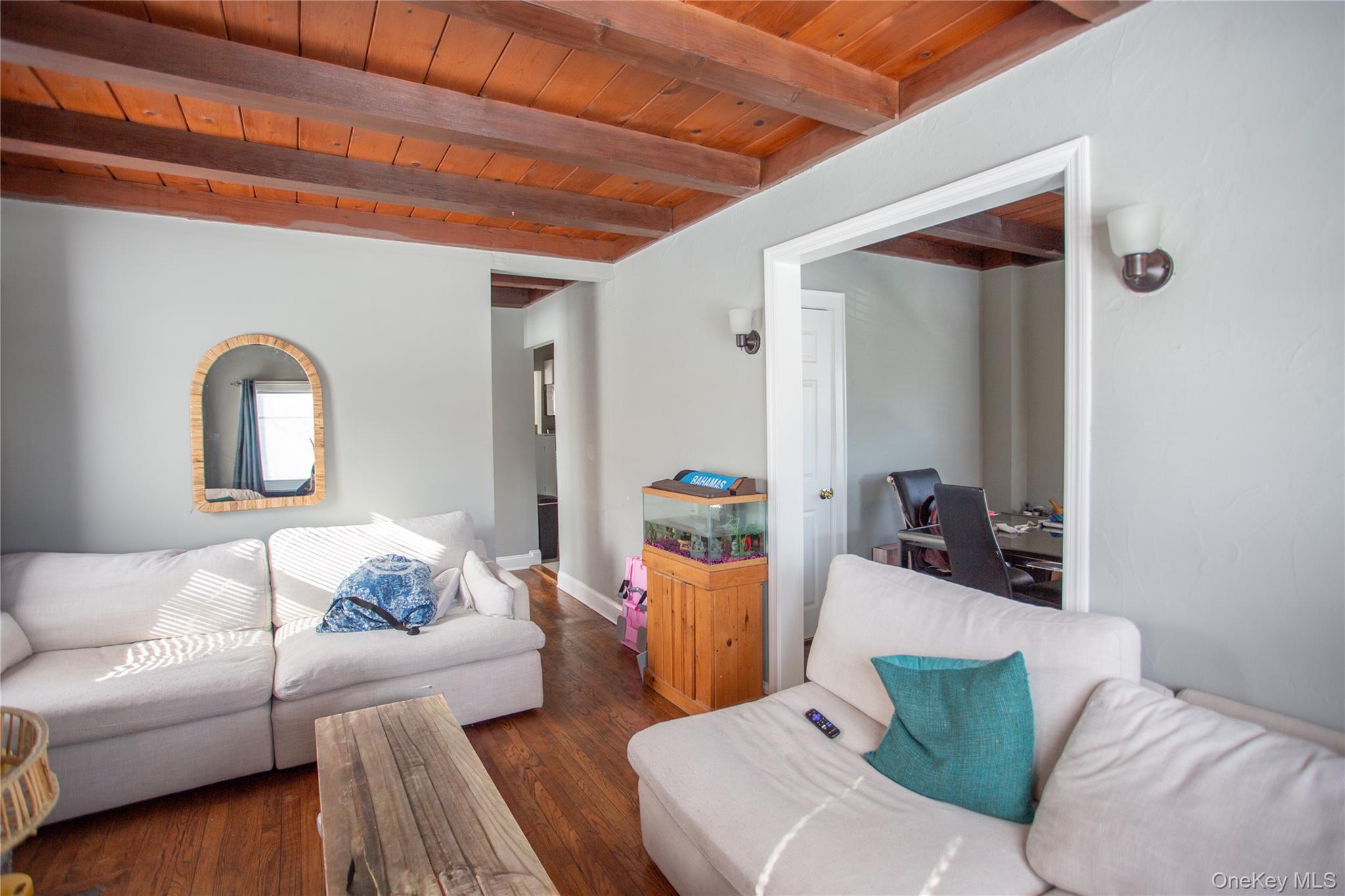261 Rutland Road Freeport, NY 11520 - Photo 10 of 15 a living room with furniture and a wooden floor