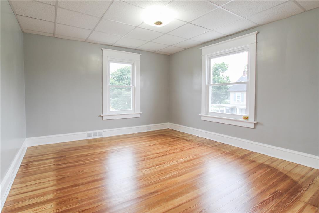 933 Philadelphia Road Easton, PA 18042 - Photo 14 of 23 Gleaming hardwood floors run throughout this versatile room framed by classic white trim.