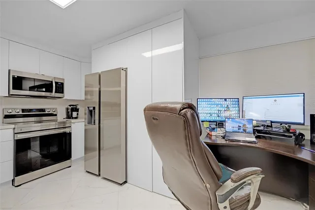 a kitchen with a refrigerator stove and sink